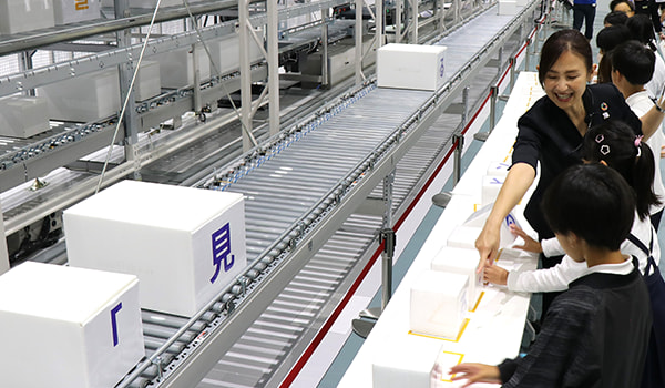 Comparing the speed and accuracy of sorting packages automatically to sorting by hand